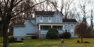 The Hines Sanders house on Hickory Nut Road in North Apollo PA, built circa 1880-1899, is a vernacular 4-Over-4 style structure with an expanded form due to the addition of 4 wings, resulting in an irregular shaped plan.